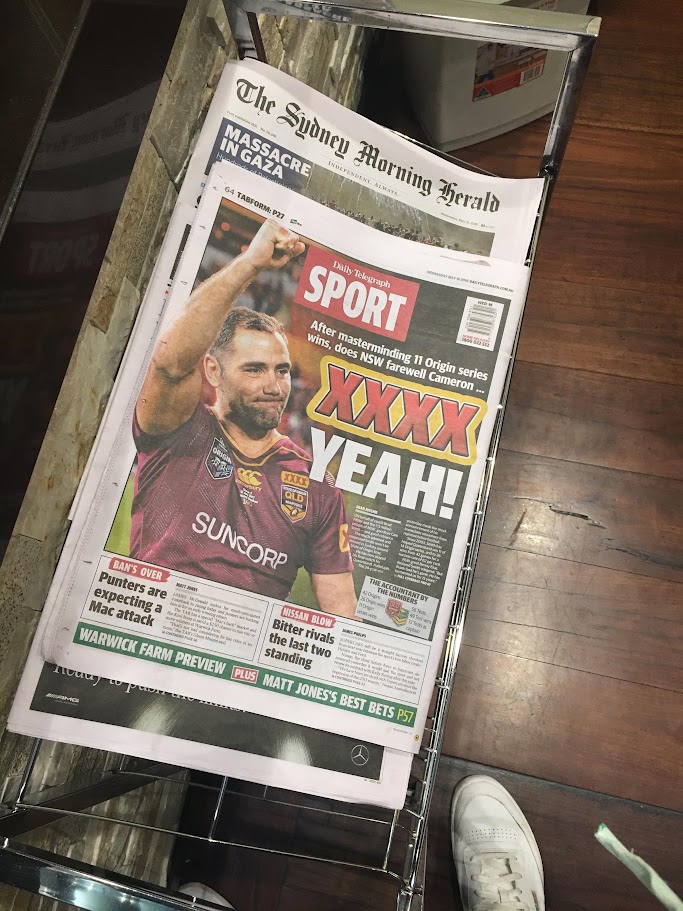 Newspaper sport front page celebrating a Queensland Maroons Origin series win with XXXX branding